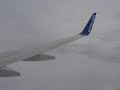 Airtran 551 descending into clouds and rain