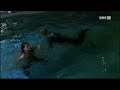a girl that falls into a pool fully...