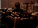 Xavier plays his guitar