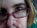 girl plays her nose