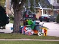 Thrown away toys, clothes crushed by garbage truck