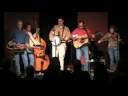 redline express performs roving gambler on november 21, 2008 at allen's market in milledgeville, georgia.  sandy nelson - bass, jessica whaley - fiddle, stelling nelson - guitar, jason lowe - banjo, aubrey nelson - shearhorn guitar