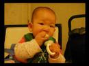 Baby Natalie eating apples with her babysafe feeder