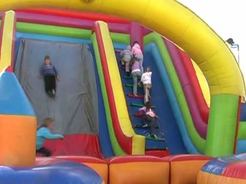 Funny kid falling down a slide
