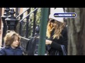 trudging through the chilly, grey streets of new york, sarah jessica parker walks the kid.