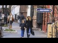 trudging through the chilly, grey streets of new york, sarah jessica parker walks the kid.