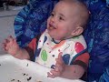 Braedon eats a hamburger on his first birthday