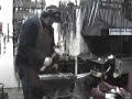 Blacksmith Mats Jonsson forging a candleholder Blacksmith Mats Jonsson forging a candleholder