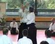 Tamura performing yokomen uchi shiho nage