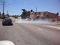 Ferrari does donuts in the middle of an intersection - burnout, donuts, ferrari, intersection
