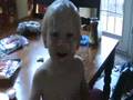 baby putting sour cream in his hair