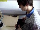 Jake Parkins playing guitar hero 3 in IT