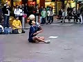 Guys juggling a soccer ball in the streets of Australia