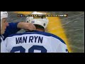 Milan Lucic hits Mike Van Ryn through the glass