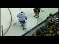 Milan Lucic hits Mike Van Ryn through the glass