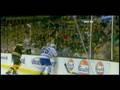 Milan Lucic hits Mike Van Ryn through the glass