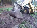 digging with backhoe excavator komatsu wb97s