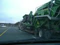 large John Deere Machine being transported