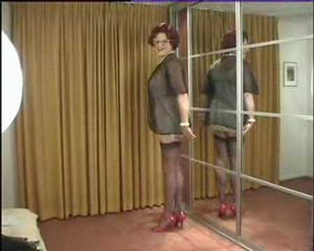 wandanylon - Mrs. Wanda Nylon, dressed in a white all in onegirdle,parading in her boudoir.