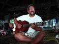 Chadd Paishon Makali`i captain sings, while the crew relax in the Men's House Satawal