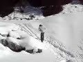 Peeing into the snow.
