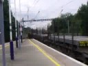 EWS class 92 passes GBRF 66 both on slow lines at huntingdon