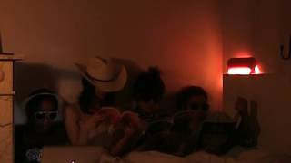 in bed with a cowgirl.