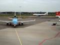 KLM MD-11 entering gate at Amsterdam Airport Schiphol