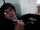 James holding "demon child" Merlin puppy