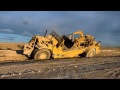 Caterpillar 657 Dirt Sharks Sloping a Bank
