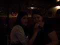 my friend therese in a karaoke bar with another girl named louisa singing the danish 