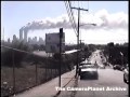 View from NJ, towers buring, people gathered watching and...