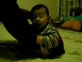 Strong baby doing sit-up's!