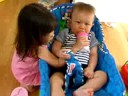 Kimberly feeds James a bottle