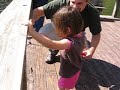 Zyanya and Uncle Andrew catch her first fish