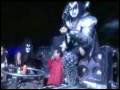 Gene Simmons falling during a concert