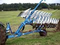 John Deere 8520 mit 9 Schar Pflug und Packer