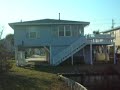 MLS# 728670 3 Bedroom Raised Beach Home $ 549,900