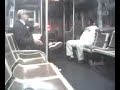Two men discuss baseball on a bus Two men discuss baseball on a bus