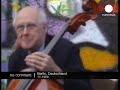 Mstislav Rostropovich performs the Sarabande from Bach's Second Suite for Solo Cello in Dm at Checkpoint Charlie while the Berlin Wall comes down in November, 1989. Checkpoint Charlie was a police station that monitored all crossings between East-West. The Berlin Wall had been erected in 1961 to prevent a 'brain drain' of the intelligentsia fleeing the communists. While its stated purpose was to protect East Germans from any remnants of Nazi influence, its real purpose was to hold captive those seeking refuge in the West. The Berlin Wall came down following peaceful demonstrations for freedom involving half a million people. When Rostropovich heard about the wall on the radio in his apartment in Paris he immediately persuaded an industrialist friend to give him a ride to Berlin in his private jet. Without knowing the destination, his friend agreed. When they landed they grabbed a taxi for the wall - but where? The wall was very extensive. They agreed that the symbolic crossing point Checkpoint Charlie was the right spot. But he had no chair! His friend grabbed a chair from one of the gate's guards, and Rostropovich began to play his deeply spiritual Bach for this momentous event, which was fortunately captured on film.