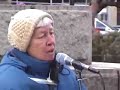 Liz McAlister, co-founder, of Jonah House, is a longtime antiwar and anti-Nuke activists. On Jan. 20, 2003, at an anti-Iraqi War rally, at Farragut Park, in Washington, D.C., she speaks out about the Star Wars scheme of Donald Rumsfeld, the Secretary of Defense.