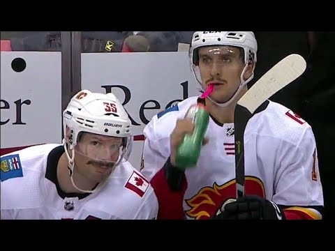 Video: Flames' Brouwer photobombs Backlund after goal to show off fine moustache