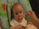 Luke eating apple sauce