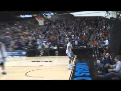 JP Tokoto Dunk Contest - North Carolina basketball player J.P. Tokoto jumps over teammate Joel James at the open practice in Kansas City before the NCAA Tournament.