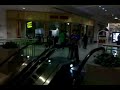 Sliding down Carosel mall escalator
