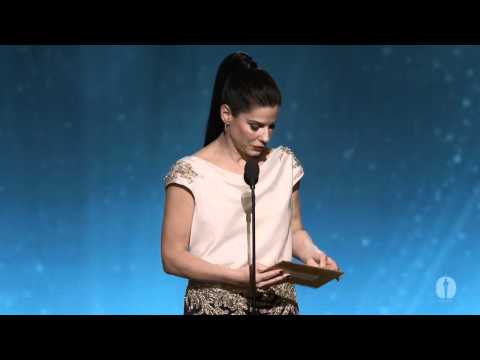 separation - Sandra Bullock presenting director Asghar Farhadi with the Oscar® for Best Foreign Language Film for Iran's