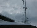 pair of eagles fly over ships, Skagway harbour, Alaska