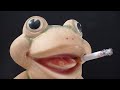 Croaker the Rubber Frog Toy Smokes a Marlboro Cigarette Croaker the Rubber Frog Toy Smokes a Marlboro Cigarette