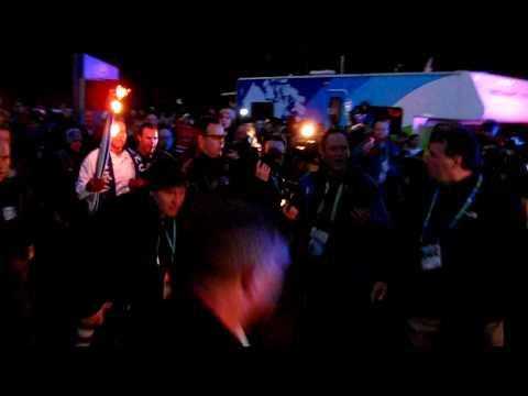 Arnold Schwarzenegger Governator carrying Olympic Torch in Vancouver