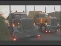 big trucks drag race in traffic